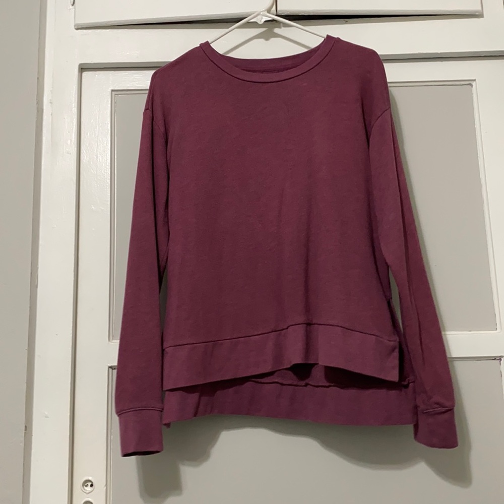 Maroon sweater. No pockets